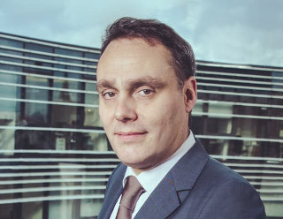 Dr.<br>Alexander Natz